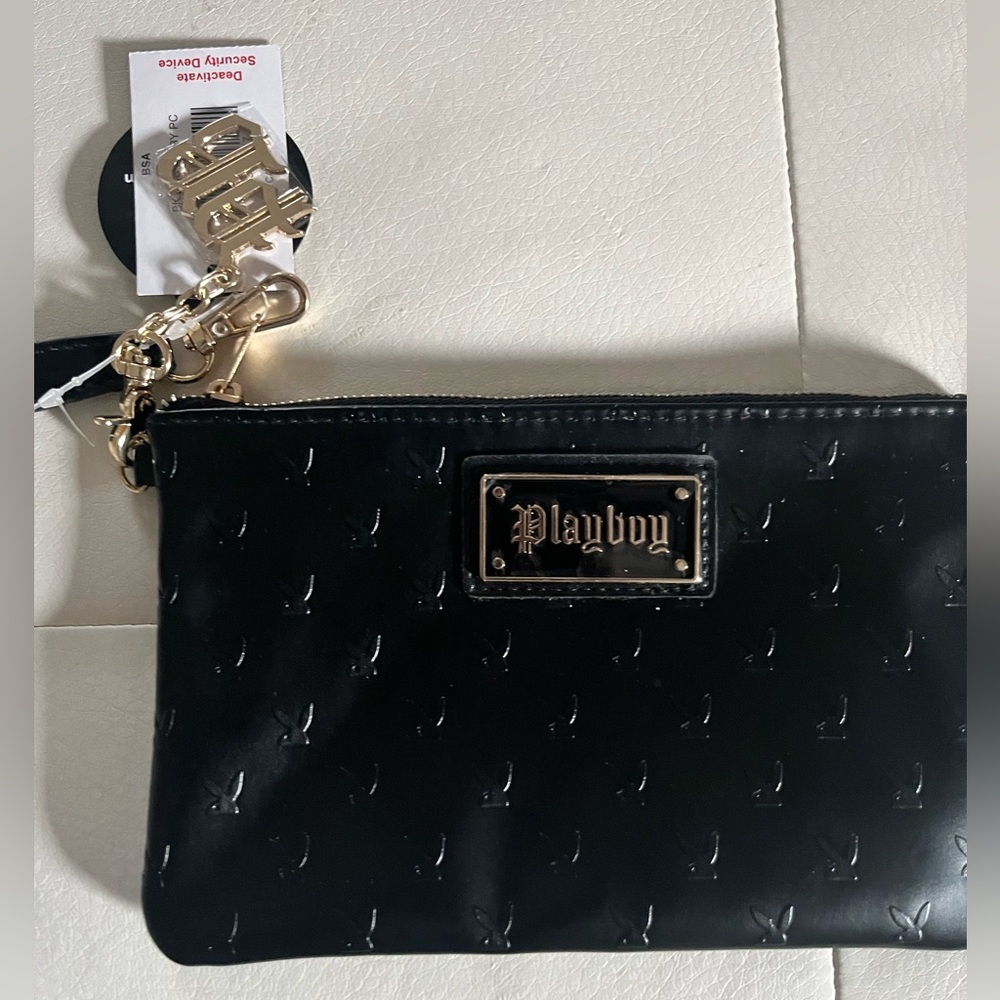 Black, mini playboy purse. Still new…